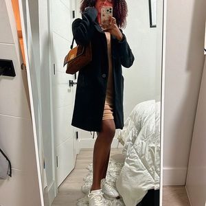 A black men’s trench coat. I’m 5”7 tall and it’s knee length for me. (Vintage)
